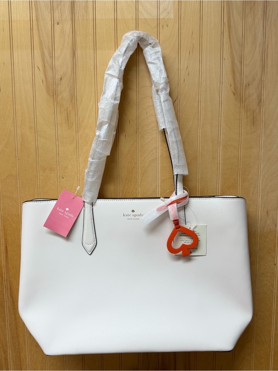 kate spade Handbags - NWT Kate Spade New York White Leather Tote Bag with Orange Charm